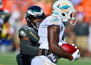 Jarvis Landry of the Miami Dolphins being tackled