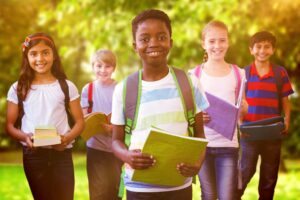 Children getting out of school happy and with there HW folders in hand in Western NY 