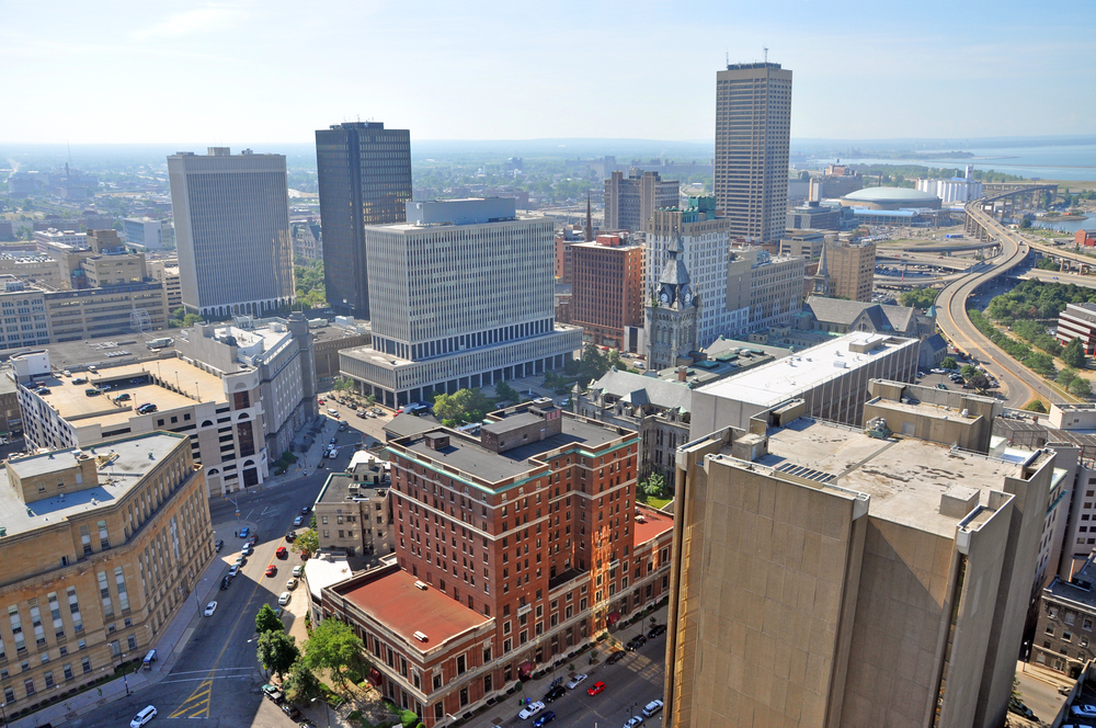 An aerial photo of downtown Buffalo NY on a sunny day as Ellicott Development lists properties for sale in the area