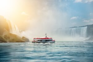 A tour boat takes group to see Niagara Falls with Ellicott Development