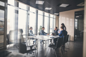 A business meeting of executives in an office about the commercial business economic growth in Buffalo during 2021