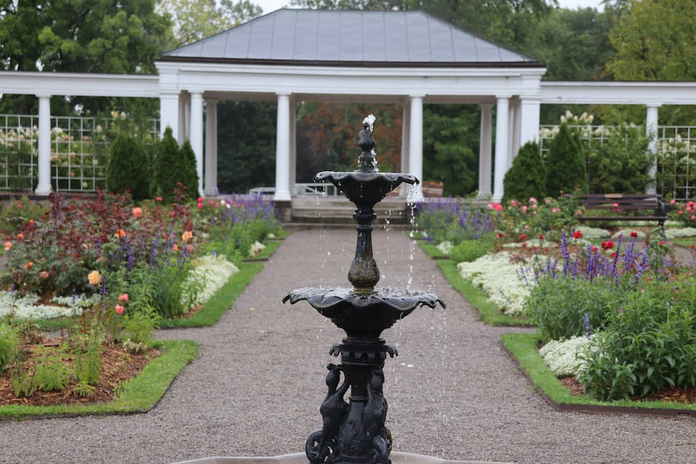 water fountain with a patio and cobble stones. Picture perfect